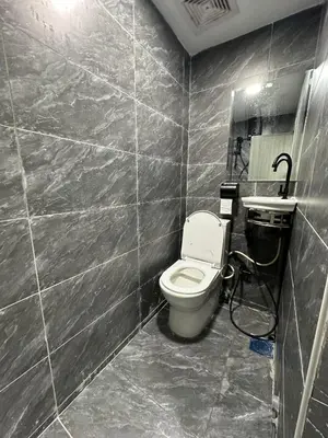 a bathroom with a toilet and a sink at SS GREY HOUSE Jalan Alor in Kuala Lumpur