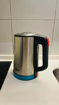 a black toaster sitting on top of a counter at chamber suites by bintang in Kuala Lumpur