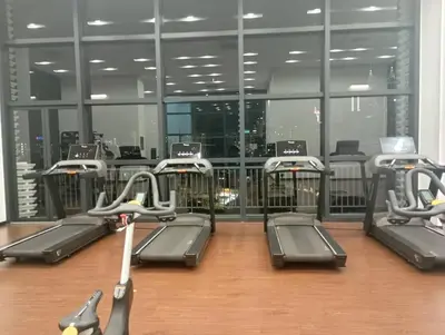 a gym with rows of treadmills in a building at chamber suites by bintang in Kuala Lumpur