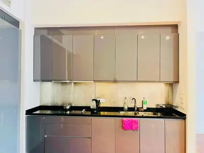 a kitchen with stainless steel cabinets and a sink at The Mews Suites KLCC By Luna in Kuala Lumpur