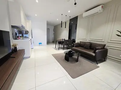 a living room with a couch and a table at Quill Residence KL Suites in Kuala Lumpur