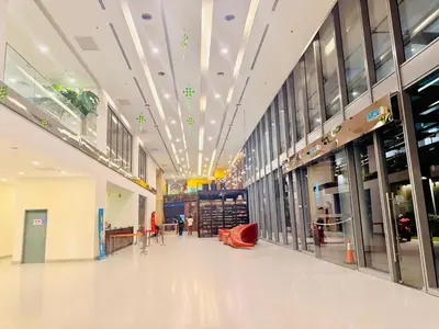 a hallway of a shopping mall with people walking around at Mercu Summer Suites KLCC By Suite Apartment in Kuala Lumpur