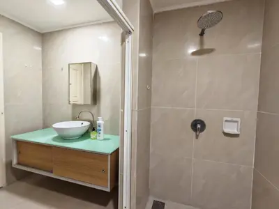 a bathroom with a sink and a shower at Parkview Serviced Apartment Kuala Lumpur Twin Tower in Kuala Lumpur