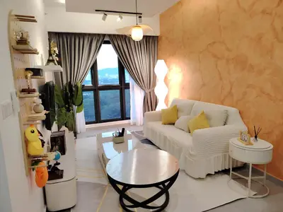 a living room with a white couch and a table at Agile Residence Dual-Key Gem Bukit Bintang by Natol Chain of Homestays in Kuala Lumpur