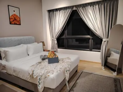 a bedroom with a bed and a large window at Agile Residence Dual-Key Gem Bukit Bintang by Natol Chain of Homestays in Kuala Lumpur