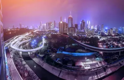 a city skyline at night with a busy freeway at M Vertica Cheras KL City Fully Air-Con Nice View Home in Kuala Lumpur