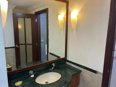 a bathroom with a sink and a large mirror at PERFECT SUITE at TIMES SQUARE KL in Kuala Lumpur