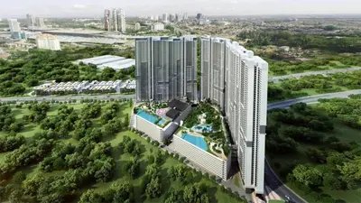 an aerial view of a tall building with a pool at Cozy Room in Kuala Lumpur