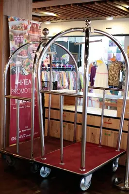 a shopping cart in a store with a clothing rack at The Grand Campbell Hotel Kuala Lumpur in Kuala Lumpur