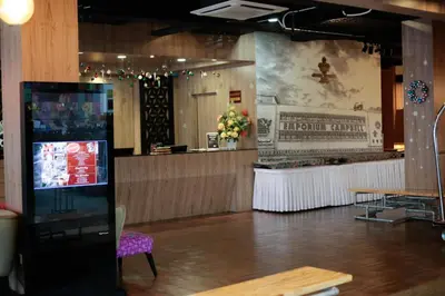 a restaurant with a counter and a bar at The Grand Campbell Hotel Kuala Lumpur in Kuala Lumpur