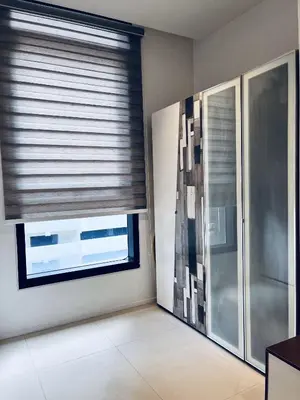 a room with a large window with blinds on it at Arcoris SOHO by Cj in Kuala Lumpur