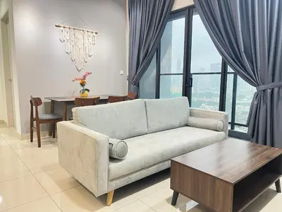 a living room with a couch and a table at Trion KL By Luxe Home in Kuala Lumpur