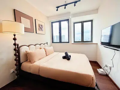 a bedroom with a bed with a teddy bear on it at Cozy Studio l Riveria City l 1km to KL Sentral in Kuala Lumpur
