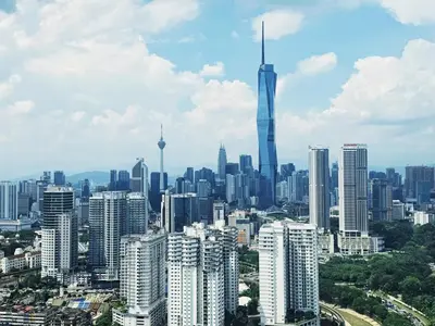 a view of a city with a tall skyscraper at Cozy Studio l Riveria City l 1km to KL Sentral in Kuala Lumpur