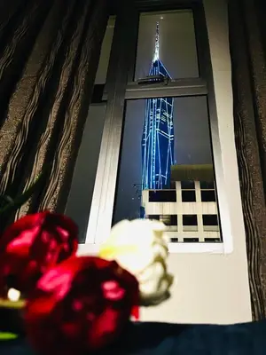 a view of the eiffel tower through a window at Central City Hotel at Chinatown in Kuala Lumpur