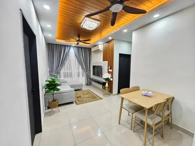 a living room with a table and a ceiling fan at Aiman Damia Homestay in Kuala Lumpur