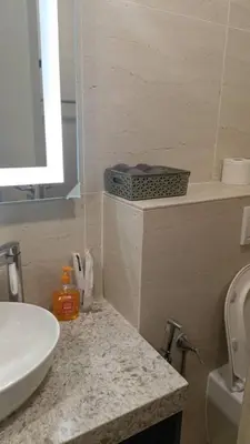 a bathroom with a sink and a toilet and a counter at Star Residence Klcc By Stellar Inn in Kuala Lumpur