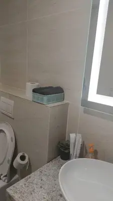 a bathroom with a white toilet and a sink at Star Residence Klcc By Stellar Inn in Kuala Lumpur