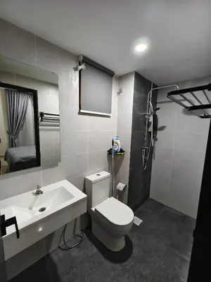 a bathroom with a white toilet and a sink at AimanDamia Homestay Setapak II in Kuala Lumpur