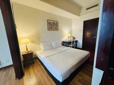 a bedroom with a large white bed in a room at Times square at suite kl in Kuala Lumpur