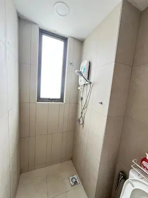 a bathroom with a shower with a window and a sink at Cozy kenwingston platz kl 2-5pax 2BR&2BR Klcc view with free parkin 4305 in Kuala Lumpur
