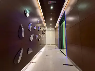 a hallway with a wall with a bunch of mirrors at SG Residence by Lush Living in Kuala Lumpur