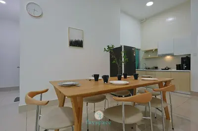 a wooden table and chairs in a kitchen at Instaworthy 2B2B - 6 pax - F&B & Mart - Chan Sow Lin in Kuala Lumpur