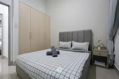 a bedroom with a large bed with a gray headboard at Instaworthy 2B2B - 6 pax - F&B & Mart - Chan Sow Lin in Kuala Lumpur