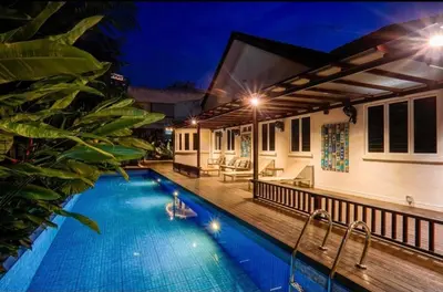 a villa with a swimming pool at night at 68 Palms 01 l Midvalley l KL Sentral l 5 Pax in Kuala Lumpur