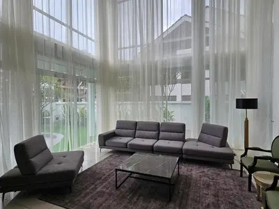 a living room with a couch and chairs and windows at Villa Homescape, Mont Kiara in Kuala Lumpur