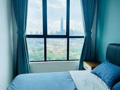 a bedroom with a large window with a city view at Lavile Homestay in Kuala Lumpur
