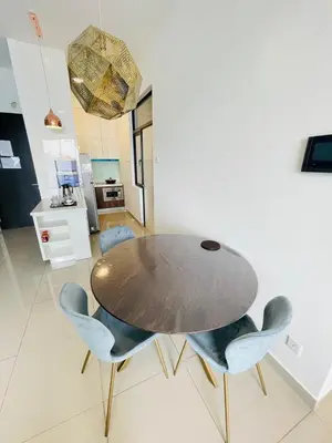 a dining room with a table and chairs at Lavile Homestay in Kuala Lumpur
