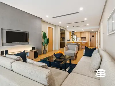 a living room with a couch and a table at 188 Suites KLCC by Soulasia in Kuala Lumpur