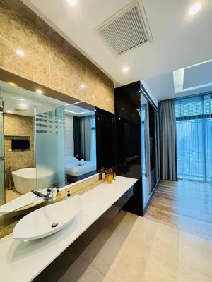 a bathroom with a sink and a large mirror at Dorsett Suites Kuala Lumpur By AFA in Kuala Lumpur