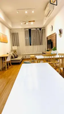 a living room with a couch and a table at Chambers Serviced Suites Kuala Lumpur in Kuala Lumpur