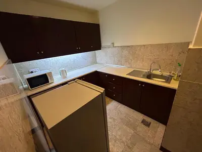 a small kitchen with a sink and a refrigerator at Times Square by Perfect in Kuala Lumpur