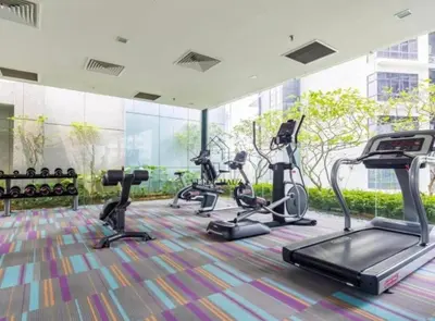 a gym with cardio equipment in a building at Summer Hotel and Condo Suites Nearby KLCC Area in Kuala Lumpur