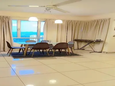 a dining room with a table and chairs with a view at PV21 Luxe Comfort 3 Bedroom Modern Homestay in Prime Location near Setapak Central Mall in Kuala Lumpur