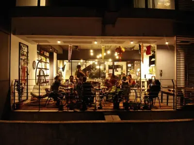 a group of people sitting at a restaurant at night at The Ohana Suite in Kuala Lumpur