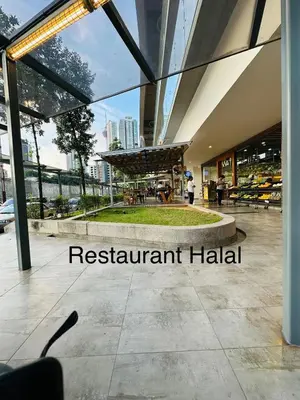 a restaurant hall with a view of the city at Robertson Residence Main City Kuala Lumpur in Kuala Lumpur