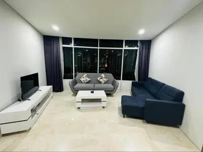 a living room with a couch and a tv at Vortex Premium Apartment klcc in Kuala Lumpur