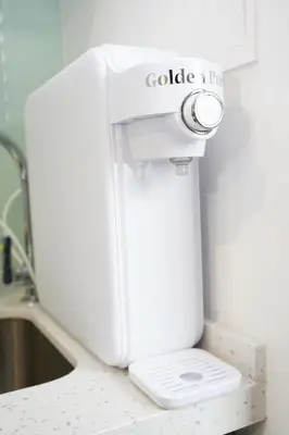 a white sewing machine sitting on top of a counter at Riveria City KL Sentral by Nest Suite in Kuala Lumpur