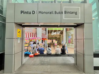 a group of people sitting inside of a shopping mall at VibeHaus 11px 2R2B Pavillion Bukit Bintang 1mins in Kuala Lumpur