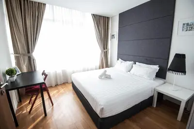 a hotel room with a bed and a desk at Vortex KLCC by LSA in Kuala Lumpur