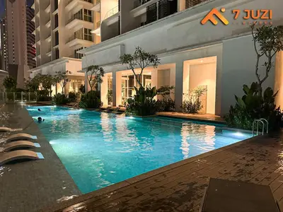 a large swimming pool in the middle of a building at Klcc Quill Cozy& Chill Suite 3-5Pax HD1080 Netflix in Kuala Lumpur