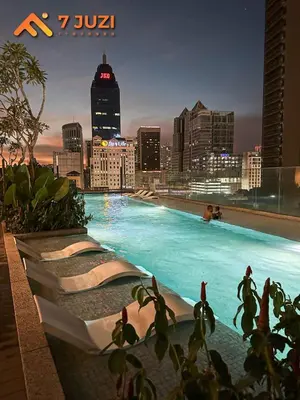 a swimming pool on top of a city skyline at Klcc Quill Cozy& Chill Suite 3-5Pax HD1080 Netflix in Kuala Lumpur