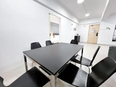 a dining room with a table and black chairs at Fahrenheit 88 Bukit Bintang by Manhattan Group in Kuala Lumpur
