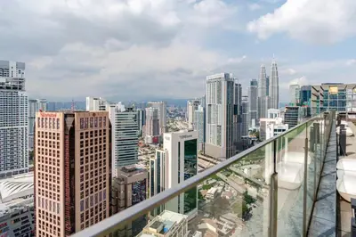 a view of a city skyline from a balcony at Designer Luxury Condo Near Bukit Bintang in Kuala Lumpur