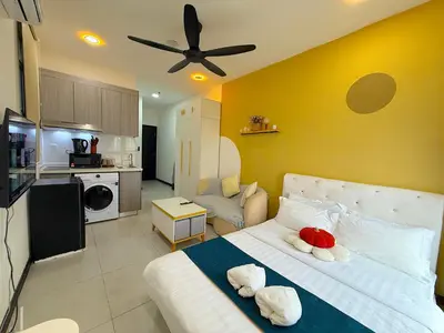 a bedroom with a bed with two stuffed animals on it at Neu Suites by Cozy Homes Near Gleneagles, KLCC & LRT in Kuala Lumpur