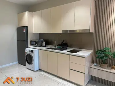 a kitchen with a washing machine and a washer at KL Tower View Luxury Cozy& Spacious Suite 4-5 Pax in Kuala Lumpur
